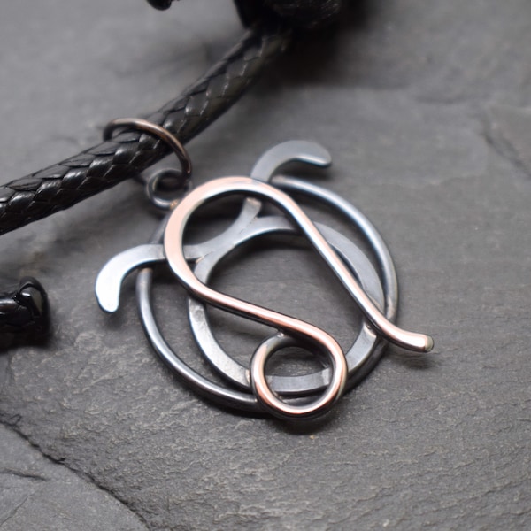 Taurus Leo necklace in oxidised and polished copper combined zodiacs