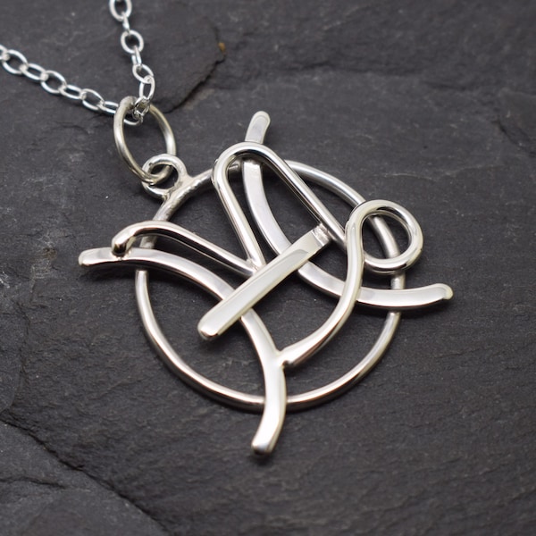 Capricorn Pisces necklace in sterling silver combined zodiacs.