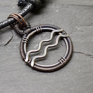 Aquarius necklace wire wrapped in oxidised copper zodiac