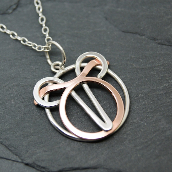 Aries Taurus necklace sterling silver and polished copper combined zodiacs.