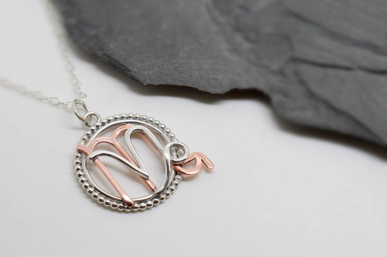 Scorpio Capricorn necklace sterling silver and polished copper with beaded edging