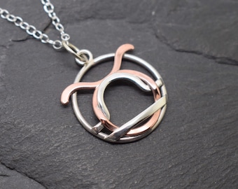 Taurus libra necklace sterling silver and polished copper combined zodiacs.