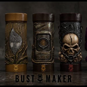 May include: Five cylindrical containers arranged in a row. The first is matte black with a red BUST MAKER logo. The others feature textured designs: a silver tree, a metallic industrial hatch, a weathered skull, and a purple creature with eyes.
