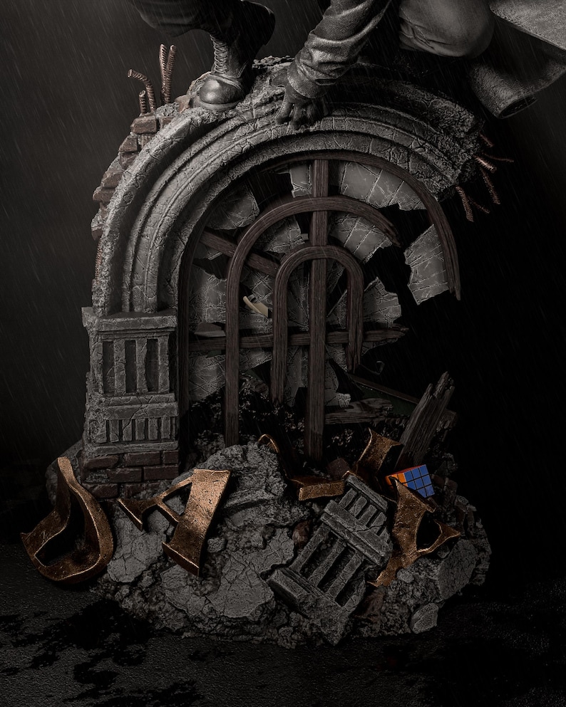 May include: A detailed statue depicting a crumbling architectural structure with a broken arched window. The statue features a figure in a dark coat and boots, perched atop the structure. The color palette is primarily gray, brown, and bronze, with a Rubik's Cube visible.