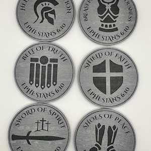 May include: Six circular gray coasters with a wood grain texture, each featuring a black engraved icon and text from Ephesians 6:10. The designs include Helmet of Salvation, Breastplate of Righteousness, Belt of Truth, Shield of Faith, Sword of Spirit, and Shoes of Peace.