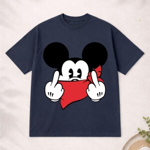 May include: Navy blue t-shirt featuring a cartoon mouse with black ears, white gloves, and a red bandana. The mouse is giving the middle finger with both hands. A humorous and edgy graphic tee.