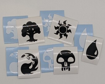 May include: A set of nine black and white stickers featuring various symbols, including a tree, a sun, a drop of water, a skull, and a flame. The stickers are on a white background.