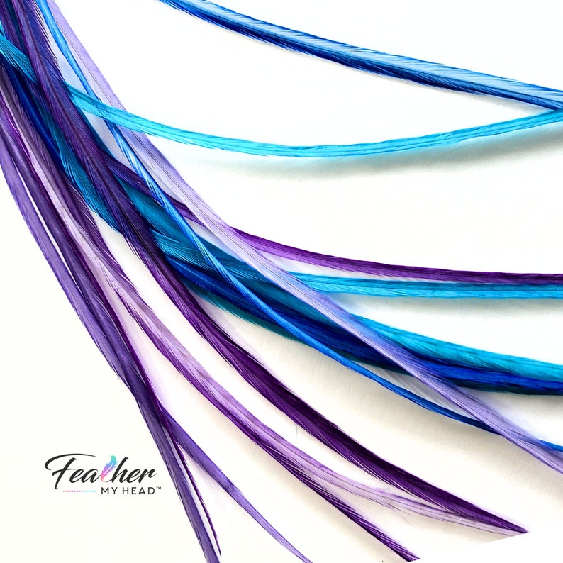 Hair Feather Extensions in colors of blue purple and turquoise. Long hair feathers with a optional feather kit which includes attachment beads, instructions and tool to pull hair through micro bead.