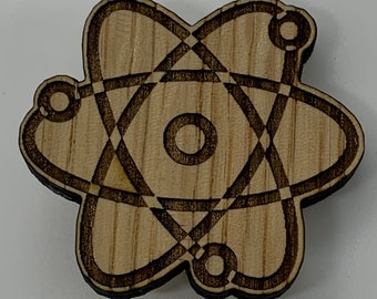 Wooden pin / atom / atomic / science /