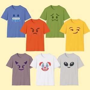 May include: A collection of seven short-sleeved t-shirts in blue, orange, green, yellow, purple, white, and gray. Each shirt features a distinct graphic print on the chest, including a frozen face, an angry face, a sad face, a smirk, a devil, a clown, and an alien.