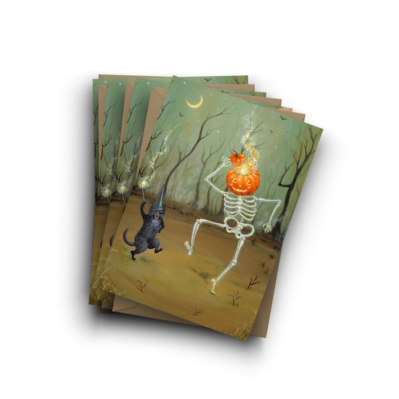 May include: A set of five Halloween greeting cards featuring a skeleton with a jack-o'-lantern head and a black cat dancing in a forest setting. The cards are printed on brown paper with a textured finish.