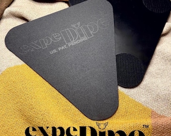 Changing Mat That Holds Diapers Open to Reduce Bunching & Tab Fumbling