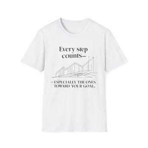 May include: White t-shirt with the text "Every step counts - Especially the ones toward your goal." The graphic includes a line drawing of a graph with an upward trend.