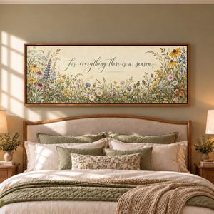 May include: A rectangular framed wall art piece featuring a cream-colored background with a colorful botanical illustration of wildflowers and the cursive text "For everything there is a season" centered in the middle of the print.