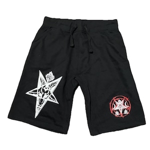 May include: Black shorts with a drawstring waist and two white pentagram designs. One pentagram features a goat head, and the other is within a red circle. The shorts are made of a soft material.