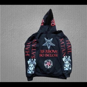 May include: Black hooded sweatshirt with red and white text and graphics. The front features a pentagram and the words "AS ABOVE SO BELOW". The sleeves and hood have the words "HAIL SATAN".