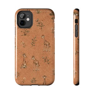 May include: A smartphone case featuring a textured terracotta orange background with a repeating pattern of illustrated giraffes, small trees, and leafy branches. The design covers the back and the side edge of the case, showing the camera cutout.