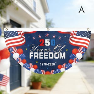 May include: A patriotic banner with the text "250 Years Of Freedom 1776-2026" in white and blue. The banner features American flags, stars, and red, white, and blue balloons. The banner is semi-circular with grommets.