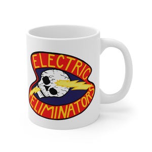 May include: White ceramic mug with a design featuring a skull, lightning bolt, and the words "ELECTRIC ELIMINATORS" in red and yellow. The design is set against a blue background. The mug has a standard handle.