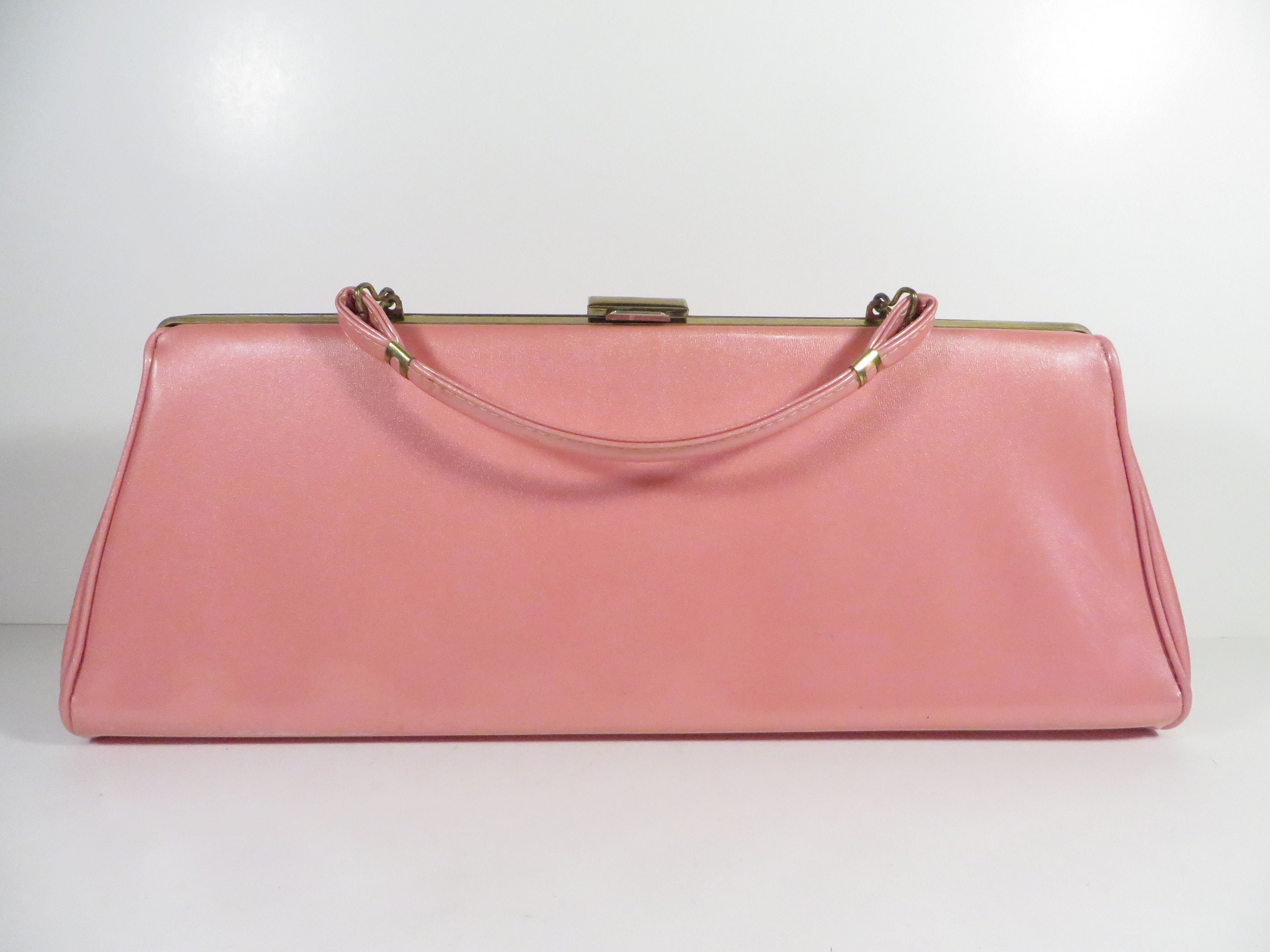 blush patent handbag