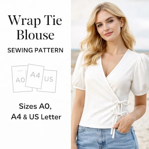 May include: A white wrap tie blouse sewing pattern. The pattern includes sizes AO, A4, and US Letter. The blouse has a V-neckline and short, puffed sleeves. The tie closure is on the side.