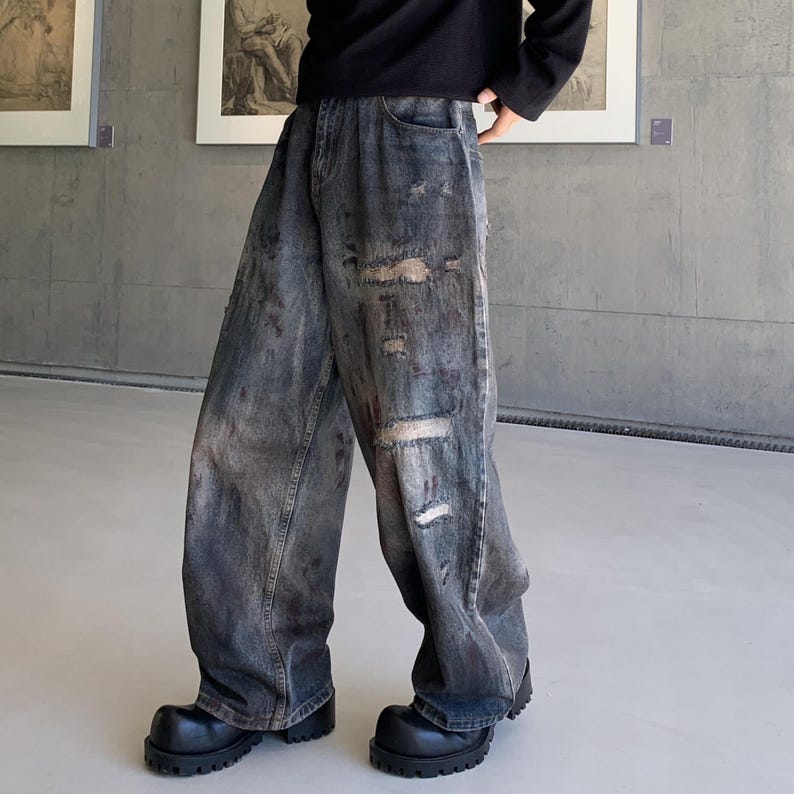 Distressed Denim Jeans | Washed Ripped Wide Leg Pants | Casual Wear | Urban Street Style

Dark washed wide-leg denim jeans with heavy distressed fading and ripped details, featuring a loose straight fit and rugged streetwear style.