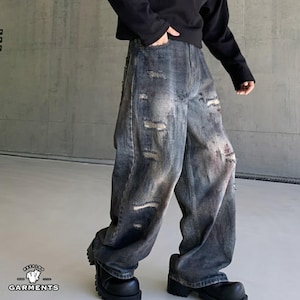 Distressed Denim Jeans | Washed Ripped Wide Leg Pants | Casual Wear | Urban Street Style

Dark washed wide-leg denim jeans with heavy distressed fading and ripped details, featuring a loose straight fit and rugged streetwear style.
