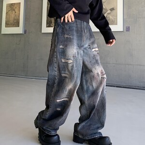 Distressed Denim Jeans | Washed Ripped Wide Leg Pants | Casual Wear | Urban Street Style

Dark washed wide-leg denim jeans with heavy distressed fading and ripped details, featuring a loose straight fit and rugged streetwear style.