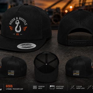 May include: A black five-panel trucker cap with a mesh back and adjustable snapback closure. The front features an embroidered silver hook logo with the text HOOK & HUSTLE CO. The side displays an American flag patch with the text WE ALL GO HOME.