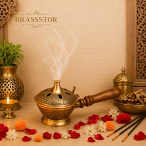 May include: A brass incense burner with a wooden handle, releasing white smoke. The burner features detailed floral patterns and is surrounded by flowers, incense sticks, and a small candle holder. The text "BRASSTOR" is visible.