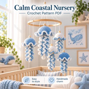 May include: A hanging mobile featuring five crocheted jellyfish in shades of blue and white, suspended from a circular wooden frame. The text Calm Coastal Nursery Crochet Pattern PDF is displayed above, with Easy to style and Handmade charm below.
