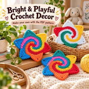 May include: Three star-shaped crochet coasters featuring a spiral pattern in vibrant colors including pink, yellow, orange, blue, and red. A sign above reads Bright & Playful Crochet Decor. Make your own with the PDF pattern.