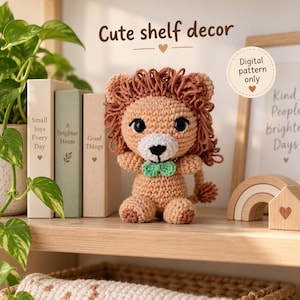 May include: A crocheted lion amigurumi with a tan body, a dark brown yarn mane, black safety eyes, a white muzzle, and a small green bow tie. The text "Cute shelf decor" and "Digital pattern only" are visible in the image.