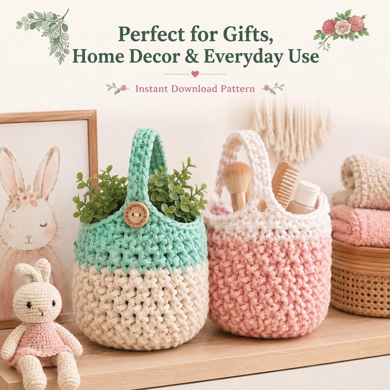 May include: Two crocheted hanging baskets with handles, one in mint green and cream and the other in pink and cream. The mint basket features a wooden button. Text reads: Perfect for Gifts, Home Decor & Everyday Use. Instant Download Pattern.