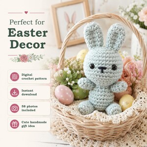 May include: A light blue crocheted rabbit toy with black eyes and a stitched nose, sitting inside a woven wicker basket filled with decorative eggs and flowers. Text on the image includes Perfect for Easter Decor, Digital crochet pattern, Instant download, 58 photos included, and Cute handmade gift idea.