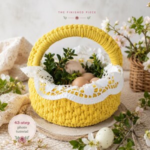May include: A bright yellow crocheted basket with a thick handle, adorned with a white lace trim along the top edge. The basket is filled with several brown eggs and green leafy sprigs. Text above reads THE FINISHED PIECE and below 43-step photo tutorial.