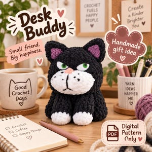 May include: A black and white crocheted cat plush with green eyes, a pink nose, and purple inner ears. The cat has white paws and a white muzzle. Text in the image includes Desk Buddy, Small friend. Big happiness., Handmade gift idea, and Digital Pattern Only.