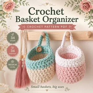 May include: A digital crochet pattern PDF for a basket organizer featuring two hanging baskets. One basket is teal and cream with a wooden button, and the other is white and pink. The text reads Crochet Basket Organizer, 34 steps, 34 photos, and medium level.