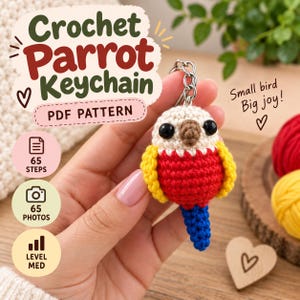 May include: A crochet parrot keychain with a cream-colored head, a brown beak, black eyes, a red chest, yellow wings, and a blue tail. The text reads: Crochet Parrot Keychain, PDF PATTERN, 65 STEPS, 65 PHOTOS, LEVEL MED, Small bird Big joy!