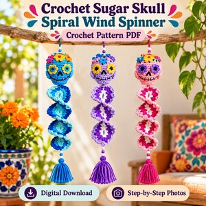 May include: Three crochet sugar skull spiral wind spinners hanging from a branch. Each features a skull with colorful floral accents, a spiraling tail, and a bottom tassel. The text reads: Crochet Sugar Skull Spiral Wind Spinner Crochet Pattern PDF.