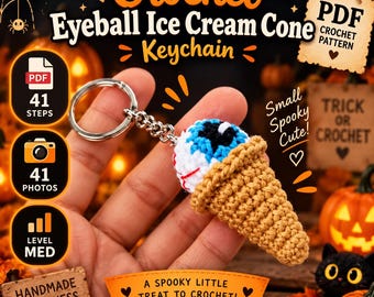 May include: A crochet eyeball ice cream cone keychain featuring a white eyeball with a blue iris and red veins inside a tan textured cone. The keychain includes a silver metal ring and chain. Text on the image includes Crochet Eyeball Ice Cream Cone Keychain, PDF Crochet Pattern, 41 Steps, 41 Photos, Level Med, Small Spooky Cute, Trick or Crochet, and A Spooky Little Treat to Crochet.