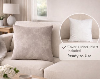 May include: A square, taupe-colored decorative pillow with a textured surface rests on a cream-colored sofa. The image includes a close-up of the pillow and an inset showing the white inner pillow. The text reads "Cover + Inner Insert Included Ready to Use."