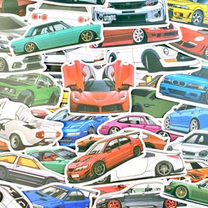 May include: A collection of die-cut stickers featuring various sports cars and performance vehicles in diverse colors including red, blue, green, white, and pink. The assortment displays multiple car models from different angles and perspectives.