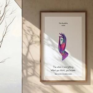 Könnte beinhalten: Ein gerahmter Kunstdruck mit einer violett-rosa verlaufenden Hand in Mudra-Geste, die eine kleine grüne Kugel hält. Der Text lautet The Buddha, 부처의말, The mind is everything. What you think you become, sowie 마음은 모든 것이다. 우리는 생각하는 대로 된다.