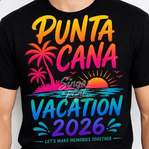 May include: Black t-shirt with a colorful graphic design. The design features the words "Punta Cana Vacation 2026" in a gradient of colors, along with palm trees, a sunset, and the phrase "Let's make memories together."