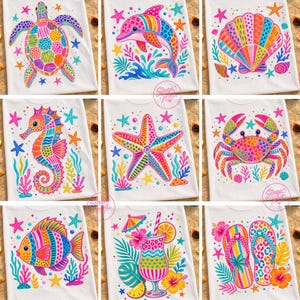 May include: White t-shirts with colorful, whimsical designs of sea creatures and summer themes. The designs include a turtle, dolphin, seashell, seahorse, starfish, crab, fish, tropical drink, and flip-flops, all with vibrant colors and patterns.
