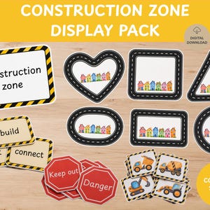 Peut inclure: Un kit de décoration sur le thème de la construction comprenant divers panneaux et étiquettes. Inclut un panneau rectangulaire à rayures jaunes et noires, des formes en cœur, carré, triangle, ovale et cercle avec bordures de route, et des véhicules.