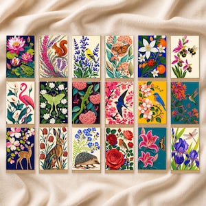May include: A set of eighteen rectangular greeting cards featuring diverse nature illustrations, including animals like a squirrel, flamingo, rabbit, and hedgehog, alongside various floral, botanical, and insect motifs in vibrant, multi-colored designs.