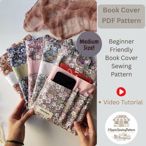 May include: Several floral fabric book covers in shades of blue, pink, and orange are displayed. The covers feature pockets and button closures. The image includes text: "Book Cover PDF Pattern" and "Beginner Friendly Book Cover Sewing Pattern".