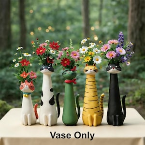 May include: Five decorative cat-shaped vases, each filled with vibrant flowers. The vases are painted in different colours, including white, black, green, and yellow, with cat faces. The text "Vase Only" is at the bottom.